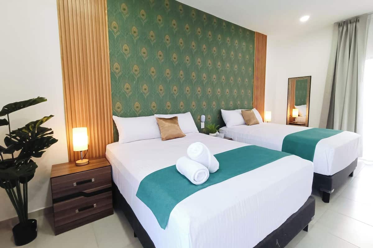 Hypo-allergenic bedding available, down comforters, in-room safe