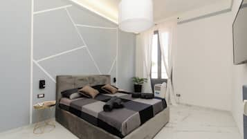 1 habitación, cortinas blackout y tabla de planchar con plancha