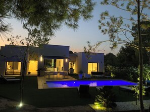 A modern house with a swimming pool, large windows, and outdoor seating. - LUXURY VILLA NEAR THE LAS COLINAS GOLF COURSE (Dehesa de Campoamor)