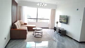 Classic Apartment | Living area | 55-inch Smart TV with cable channels, Netflix, first-run movies