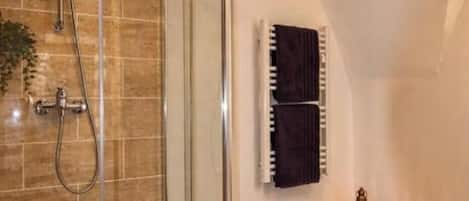 Shower, eco-friendly toiletries, hair dryer, towels