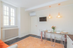 Apartment (1 Bedroom) | Living area | 32-inch Smart TV with cable channels