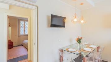 Apartment (1 Bedroom) | Living area | 32-inch Smart TV with cable channels