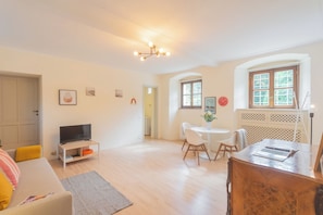 Apartment (1 Bedroom) | Living area | 32-inch flat-screen TV with cable channels - La Piazza di Cernobbio by Rent all Como (Cernobbio)