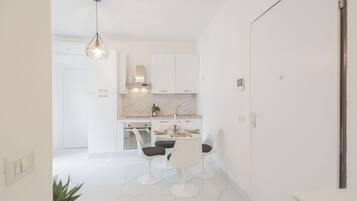 Apartment (1 Bedroom) | Living area | 32-inch flat-screen TV with cable channels