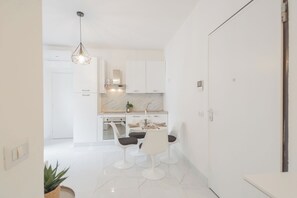 Apartment (1 Bedroom) | Living area | 32-inch flat-screen TV with cable channels - Luce Apartment by Rent all Como (Como)