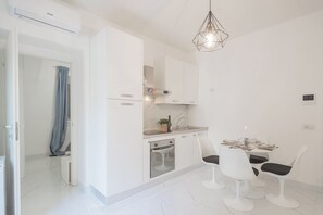 Apartment (1 Bedroom) | Living area | 32-inch flat-screen TV with cable channels - Luce Apartment by Rent all Como (Como)