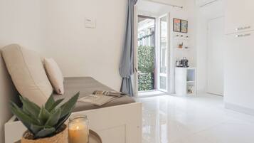 Apartment (1 Bedroom) | Living area | 32-inch flat-screen TV with cable channels