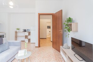 Apartment (1 Bedroom) | Living area | 32-inch flat-screen TV with cable channels - Nonna Tere Apartment by Rent all Como (Carate Urio)