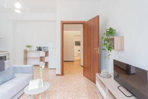 Apartment (1 Bedroom) | Living area | 32-inch flat-screen TV with cable channels