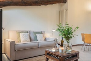 Apartment (2 Bedrooms) | Living area | 32-inch flat-screen TV with cable channels