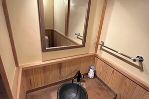 A bathroom with a wooden vanity, a mirror, a towel rack, and a sink. - Shimizu Kozuki 6min walk to Kiyomizu-dera Temple (Kyoto)