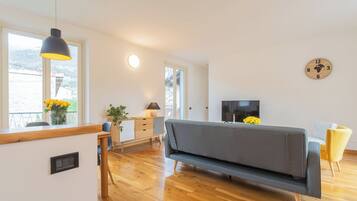 Apartment, 1 Bedroom (Ponente Balcony) | Living area | 32-inch Smart TV with digital channels