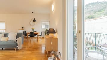 Apartment, 1 Bedroom (Ponente Balcony) | Living area | 32-inch Smart TV with digital channels