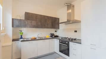 Apartment, 1 Bedroom (Ponente Balcony) | Private kitchen | Oven, high chair