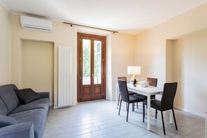 Apartment (1 Bedroom) | Living area | 32-inch TV with cable channels