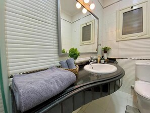 Shower, eco-friendly toiletries, towels, soap