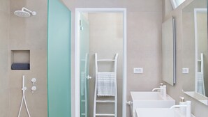 A modern bathroom with a glass shower enclosure, two sinks, and a large mirror. - Almyra Luxury Pool Suite with Private Pool (Πάνορμος)