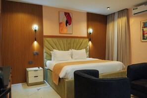 Deluxe Double Room Single Use | Living area | TV