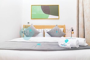 2 chambres, coffre-fort, fer et planche à repasser