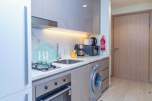 Fridge, microwave, stovetop, coffee/tea maker