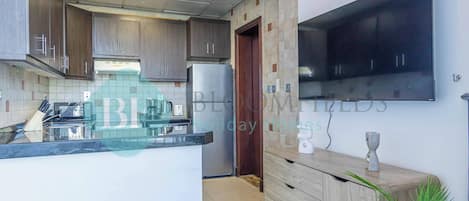 Fridge, microwave, stovetop, coffee/tea maker