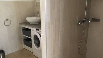 Shower, hair dryer, towels, toilet paper