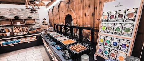 A buffet setup with various food items and a display of packaged goods.
