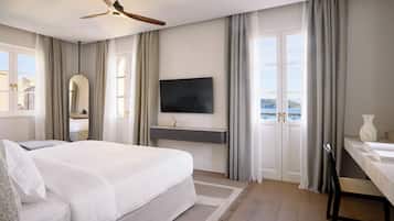 Suite estudio Deluxe, vista al mar | Ropa de cama de alta calidad y minibar