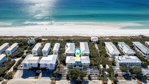 A coastal property with multiple white buildings, a beach, and a clear view of the ocean. - Beachside in Seaside, FL, 3 King Suites, Amazing Gulf Views - 2 Adult Bikes! (Santa Rosa Beach)
