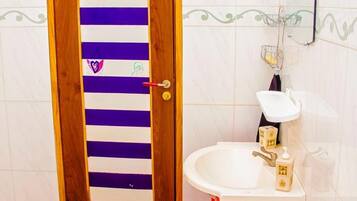 Shower, towels, soap, toilet paper