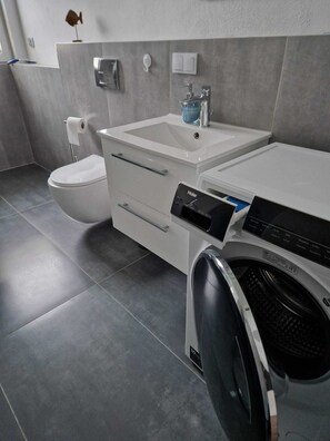 Shower, hair dryer, towels, soap
