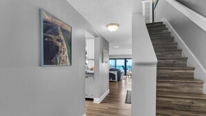 A staircase leading to a balcony with a view of the ocean. - Santa Rosa Dunes 825 (Pensacola Beach)