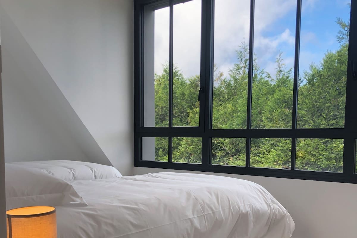 2 bedrooms, blackout curtains, soundproofing, iron/ironing board