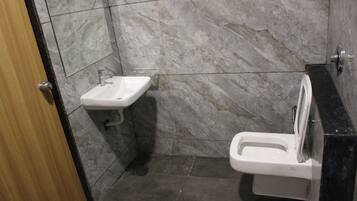Basic Double Room, Valley View | Bathroom | Shower, rainfall showerhead, slippers, towels