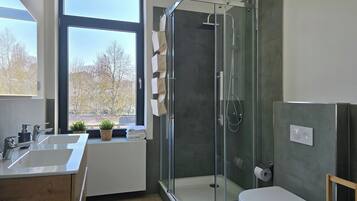 Shower, hair dryer, towels, soap