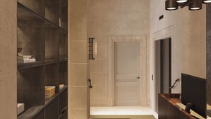 Un espace d’accueil moderne avec un comptoir de réception en bois, une grande étagère sombre et un design minimaliste.
