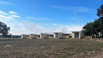 Simple, single-story buildings line the horizon.