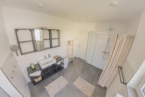 Shower, towels, soap, toilet paper