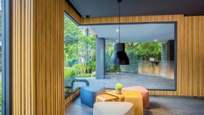 A modern interior with a large window, wooden panel walls, and a hanging light fixture. - Thai me up the Tower (Chalong)