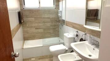 Shower, towels, soap, toilet paper