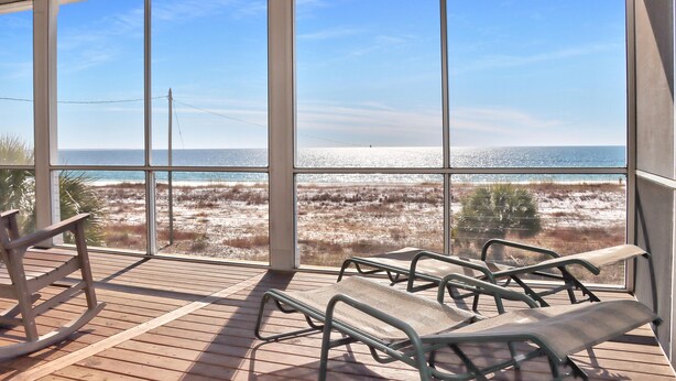 A balcony with a view of the beach and ocean. - Windchimes (Port St. Joe)