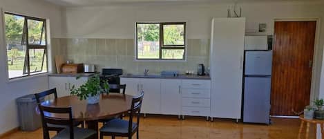 Cottage, 1 Bedroom, Patio, Garden View | Private kitchen | Full-sized fridge, microwave, oven, stovetop