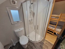 Shower, hair dryer, towels, shampoo