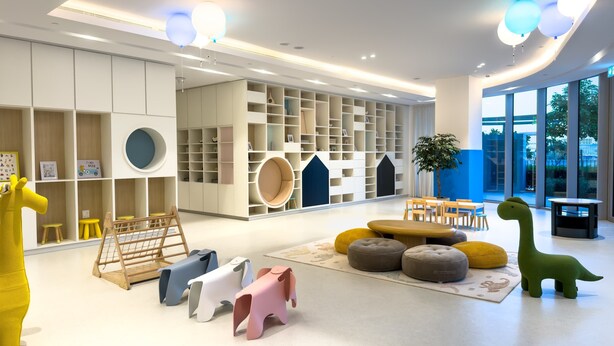 A modern children's play area with a variety of colorful toys, a large bookshelf, and a seating area with a view of the outdoors. - One Lux Stay Grande Signature Residences (Dubai)