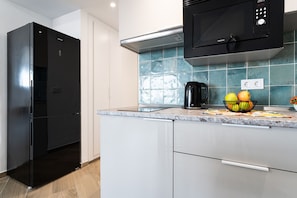 Fridge, microwave, stovetop, coffee/tea maker