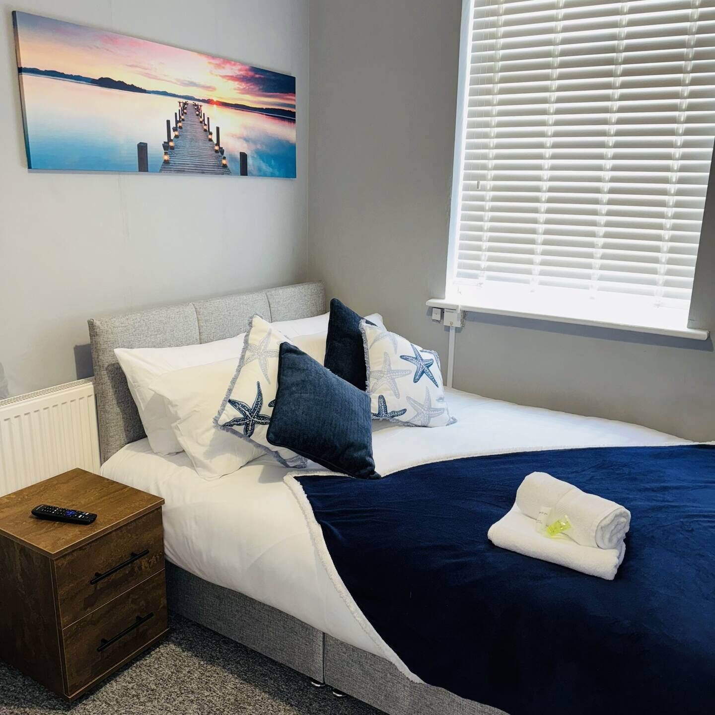 Stylish double bedroom with soft bedding, plush pillows, and a relaxing atmosphere for a great night's sleep.