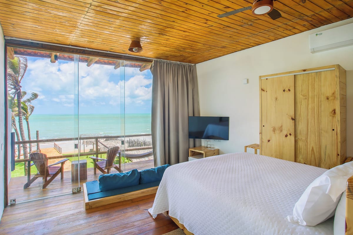 Deluxe Double Room, Balcony, Beach View | In-room safe, desk, laptop workspace, blackout drapes