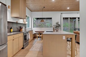Fridge, microwave, oven, stovetop - Modern home with 2 master bedrooms, private hot tub, garage and mountain views (Silver Star Mountain)