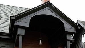 A house with a black front door, a small porch, and a mailbox. - Big Blue - Stylish Studio in Downtown Lexington (Lexington)